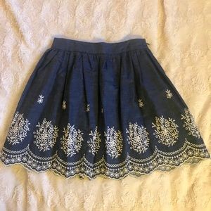 Cute denim skirt with white embroidered details